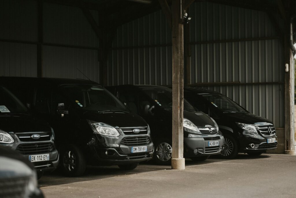 a row of parked cars in a garage